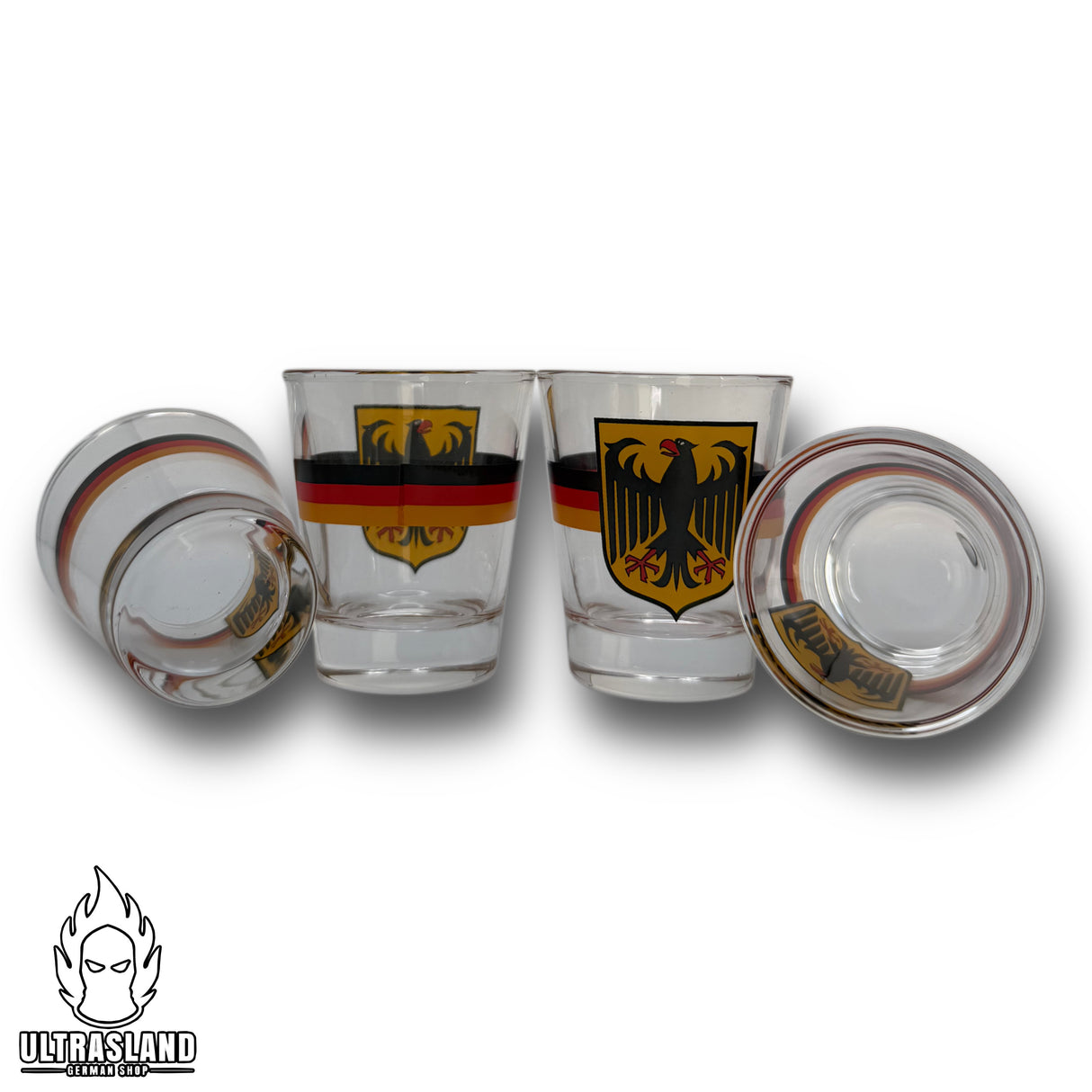 Zwei stehende und zwei liegende Deutschland-Schnapsgläser mit Adler-Wappen